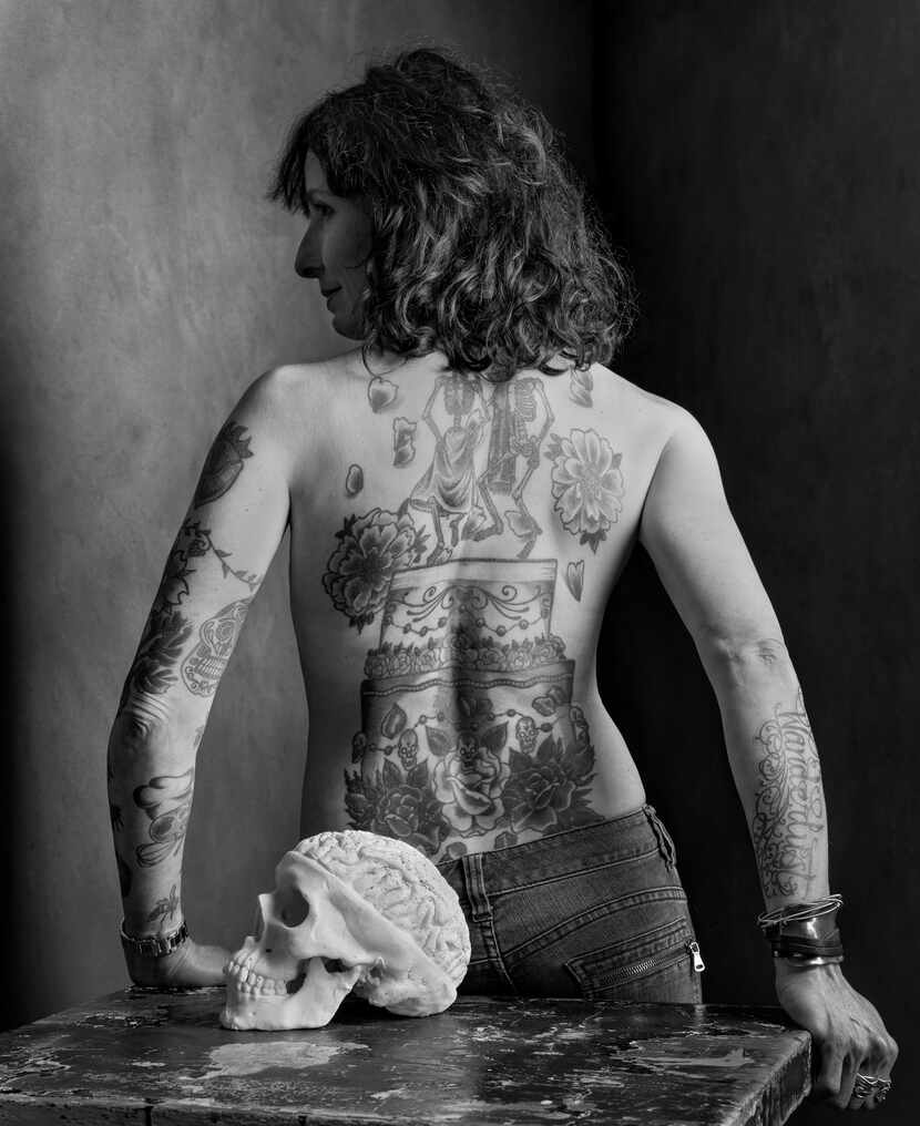 Pastry chef Katherine Clapner reveals her intricate back tattoos in this portrait.