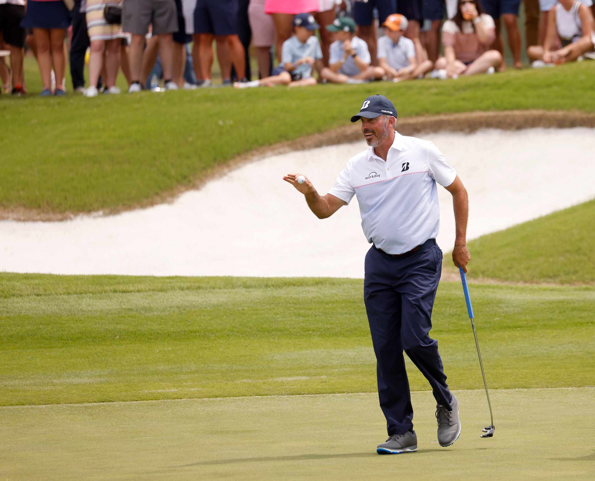 Matt Kuchar acknowledges the crowd after getting a birdie on the 12th hole during round 3 of...