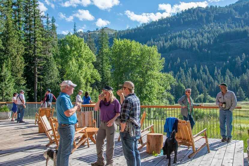 Guests congregate on the deck at the Minam River Lodge. 