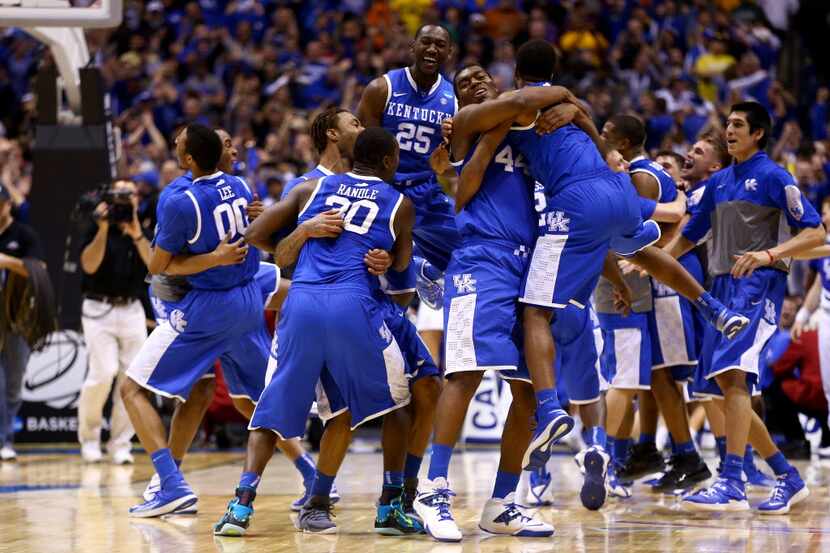 INDIANAPOLIS, IN - MARCH 30:  Aaron Harrison #2 of the Kentucky Wildcats celebrates with...