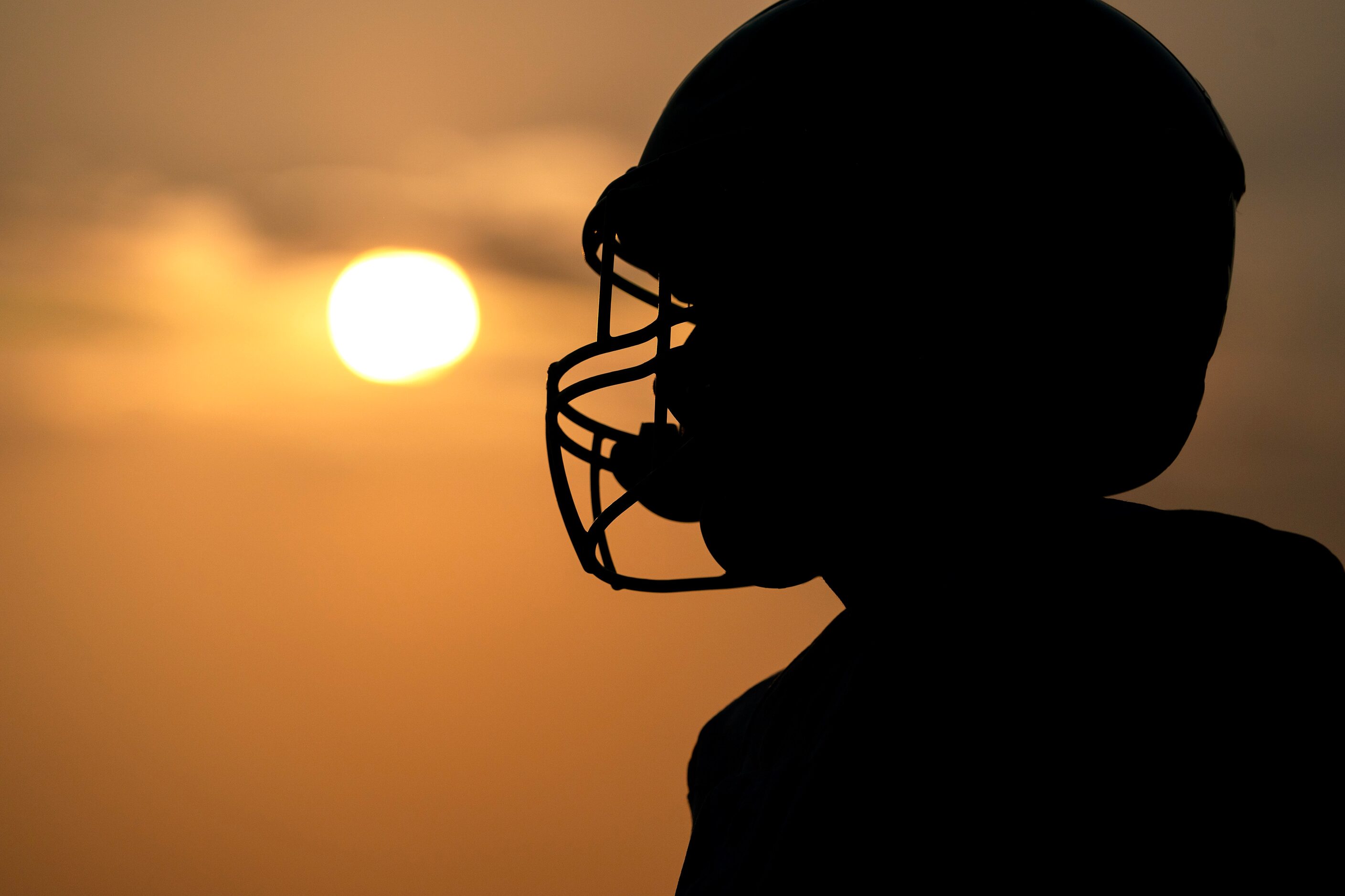 A Parish Episcopal player warms up as the sun sets before a high school football game...