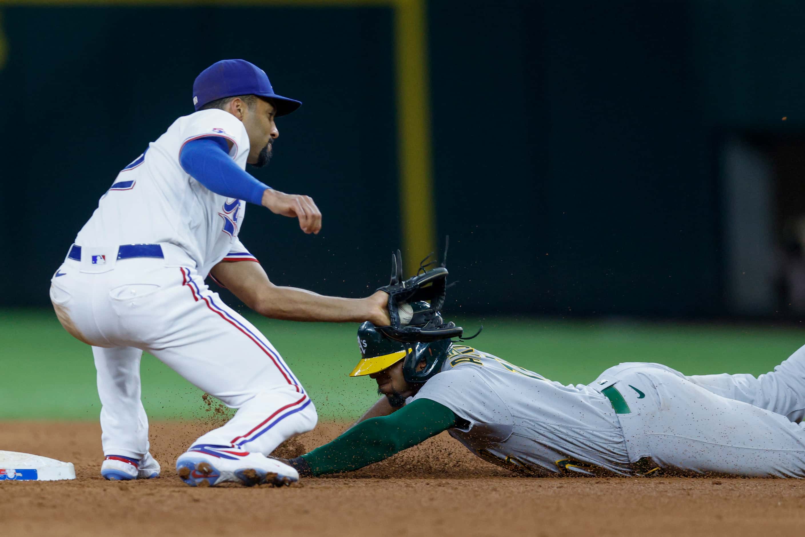 Texas Rangers second baseman Marcus Semien (2) catches Oakland Athletics shortstop Elvis...