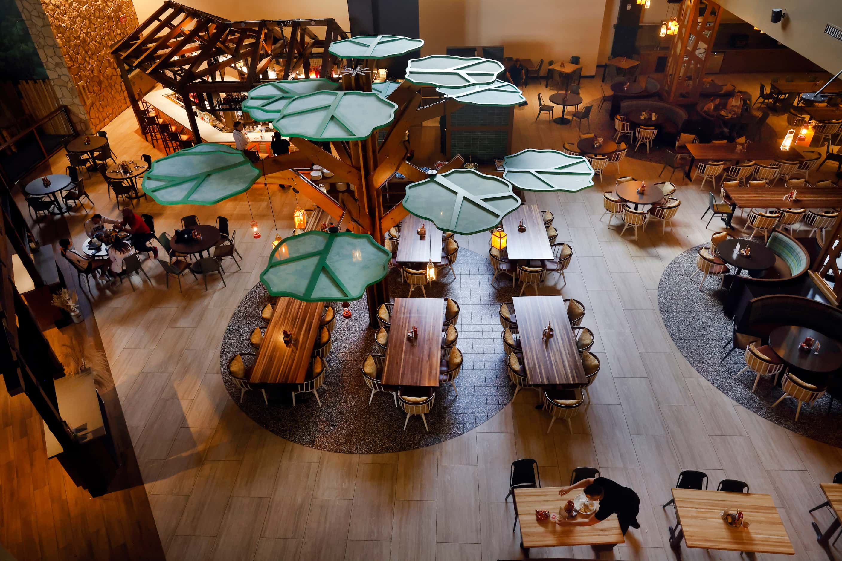 The renovated Timbers Table & Kitchen dining space adjacent to the lobby is seen from above...