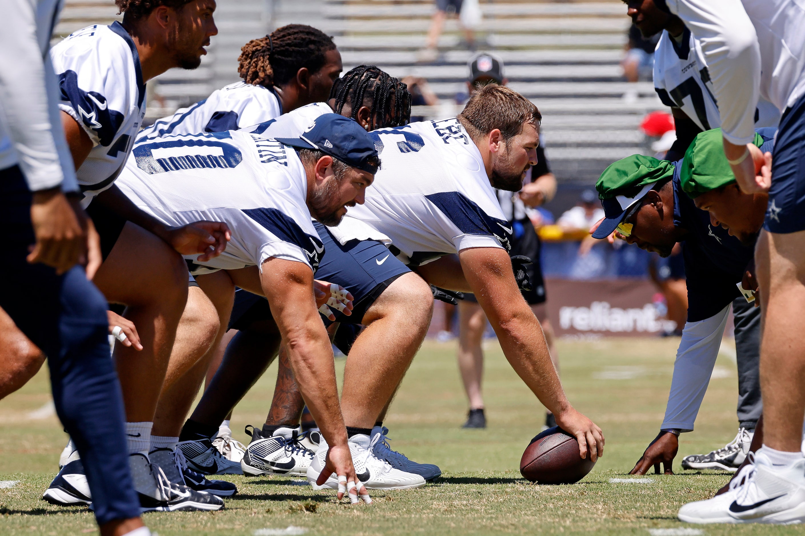 Dallas Cowboys center Cooper Beebe (56) prepares to snap the football during a mock game...