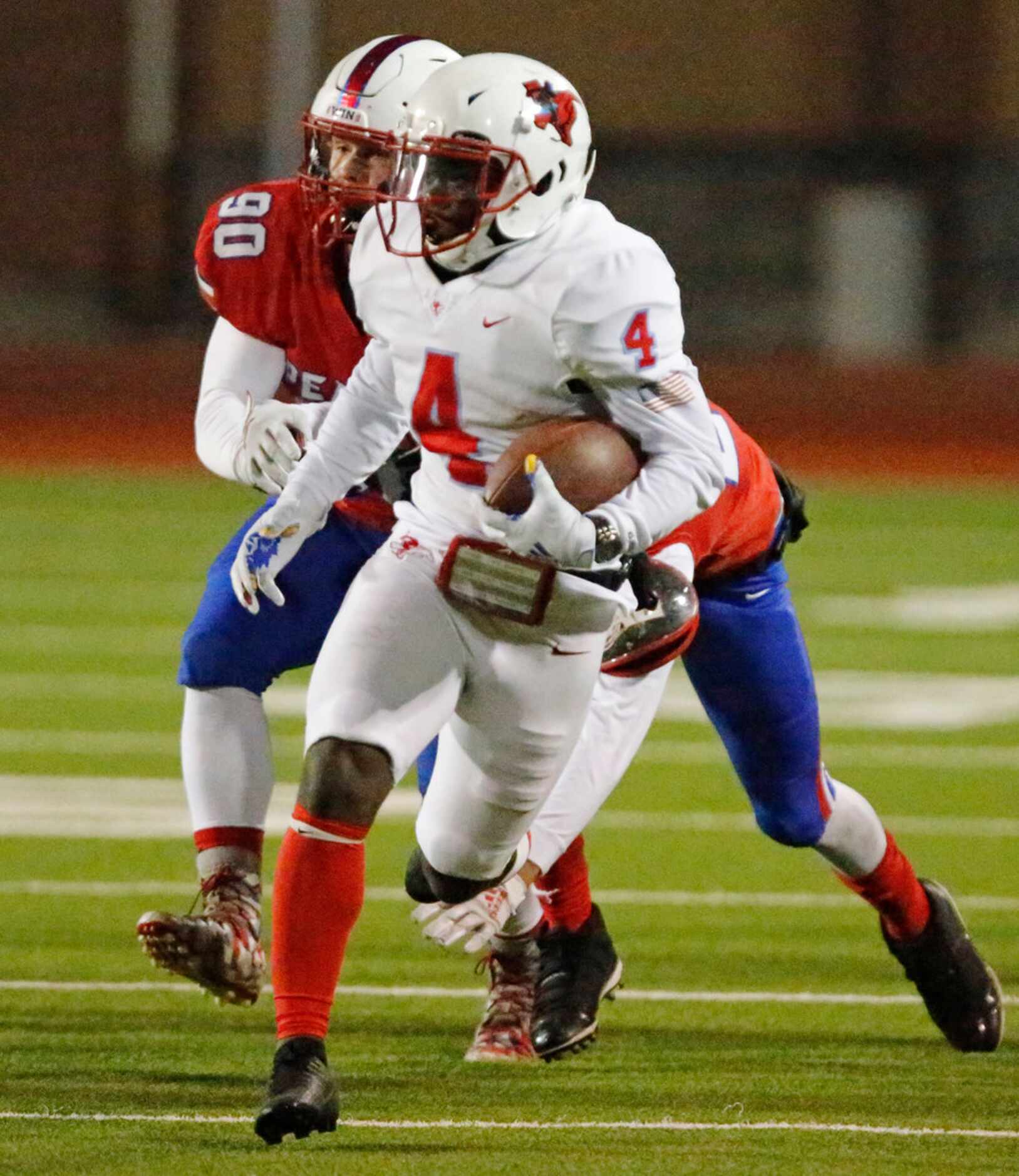 Skyline High School running back Qualon Farrar (4) gets past J.J. Pearce High School...