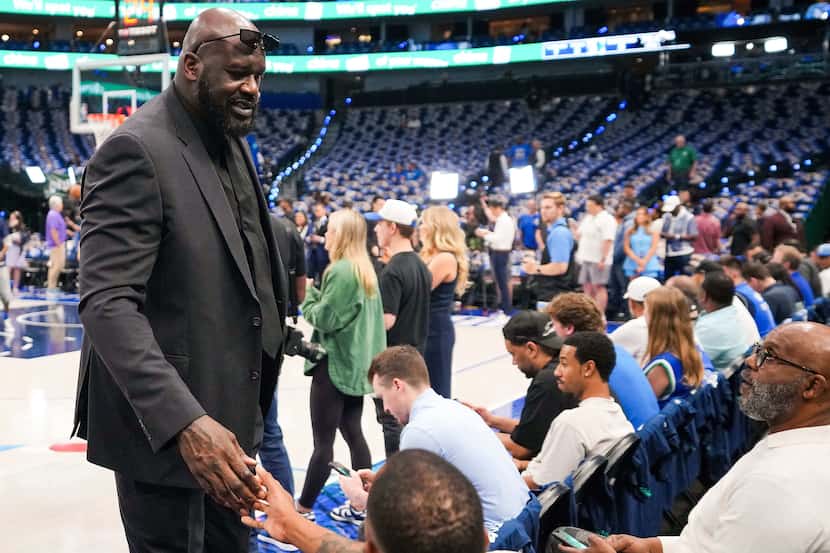 Shaquille O'Neal watches the teams warm up before Game 3 of the NBA basketball Western...