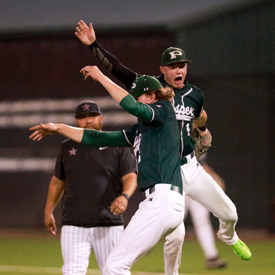 Prosper pitcher Lucas Davenport (left) celebrates with teammate Jacob Nelson after winning...