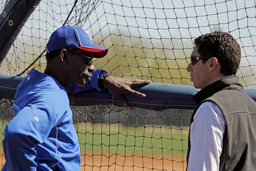 Texas Rangers manager Ron Washington (left) talks with general manager Jon Daniels during...