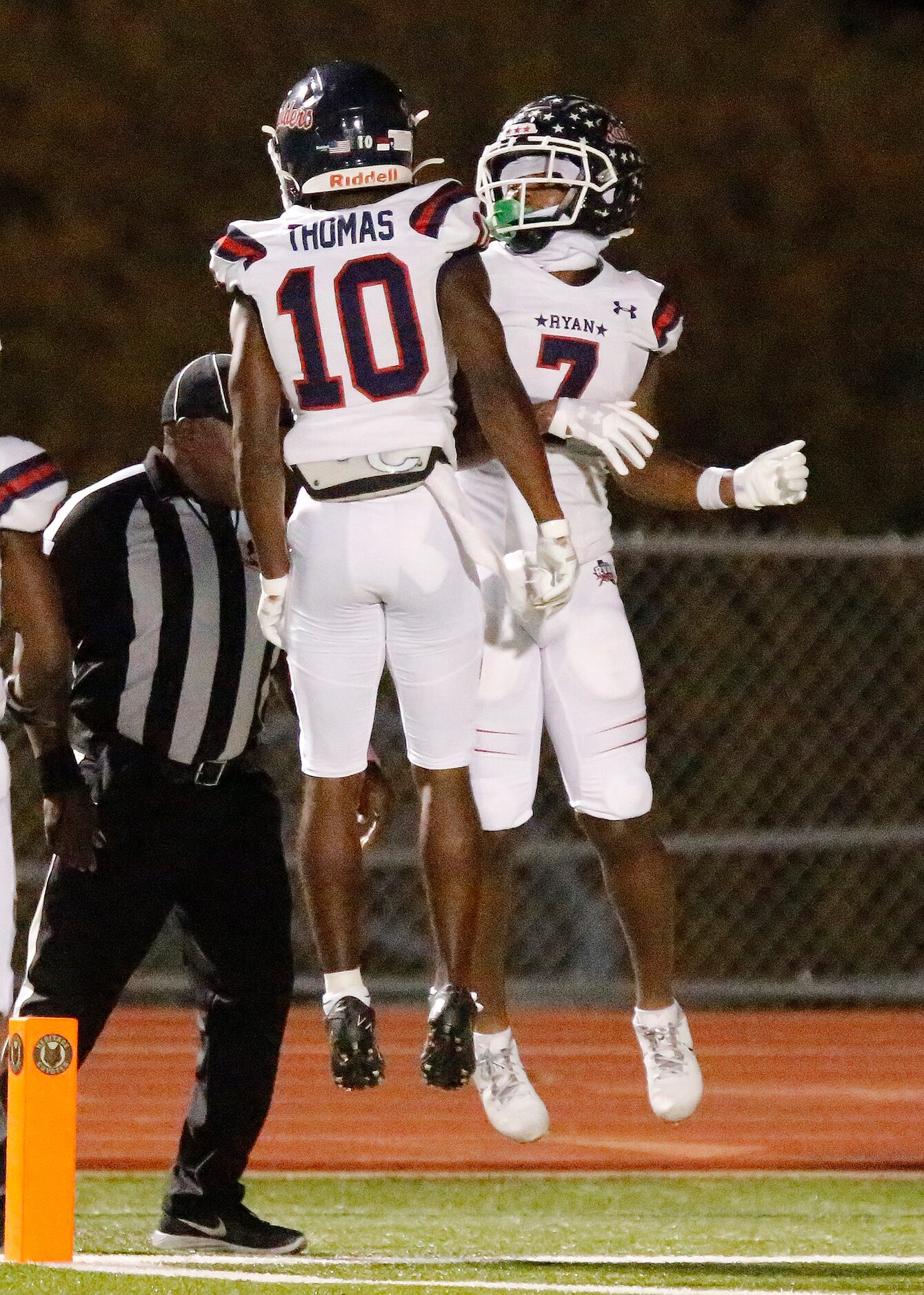 Denton Ryan High School wide receiver Antonio Thomas (10) and Denton Ryan High School...