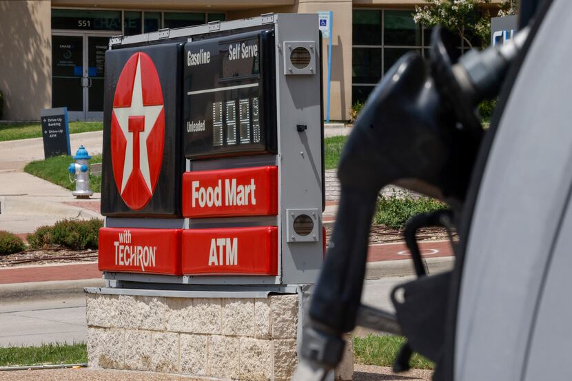Gas prices are shown at a Texaco station at 15th Street and   North Central Expressway in...