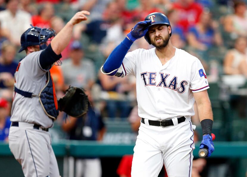 FILE - Joey Gallo (right) reacts to his bases-loaded strikeout in the third inning of a game...