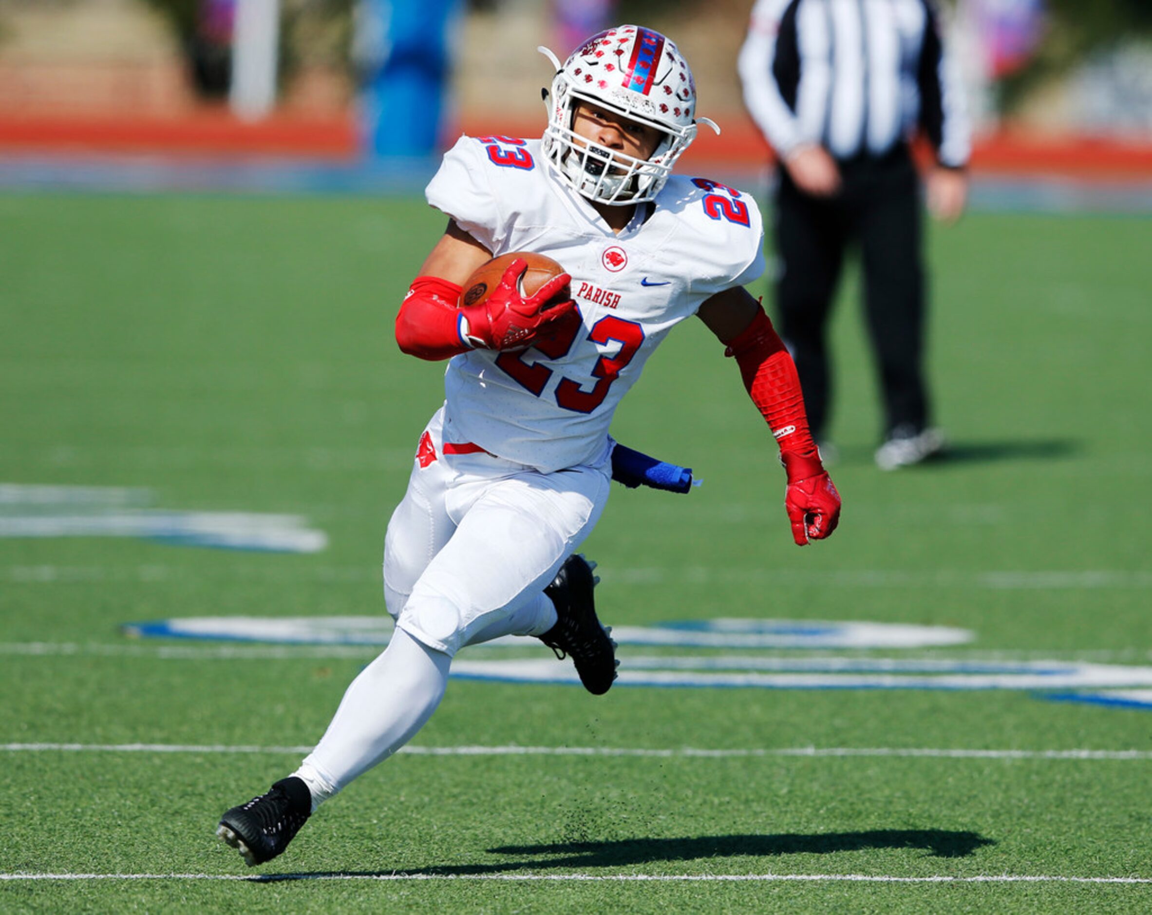 Parish Episcopal's Christian Benson (23) runs up the field in a game against Plano John Paul...