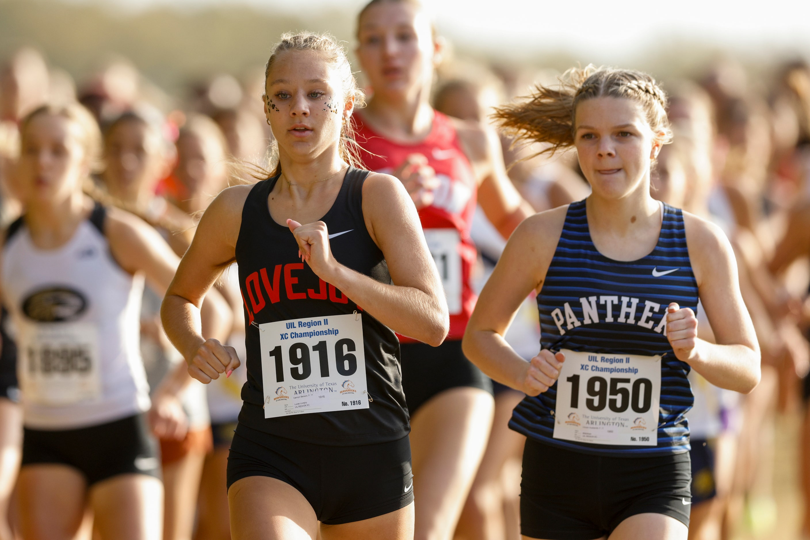 Lucas Lovejoy’s Camryn Benson (left) runs alongside Midlothian’s Lincoln Husbands during the...