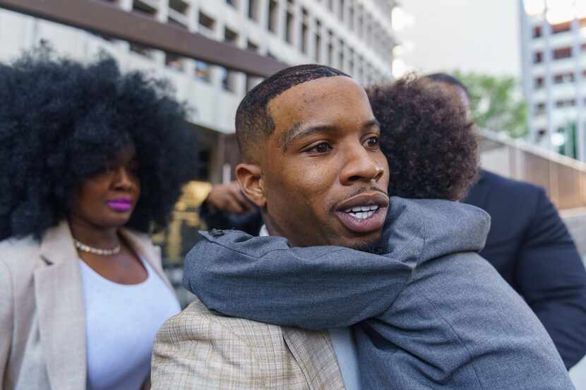 Rapper Tory Lanez, 30, walks out of the courthouse while holding his 5-year-old son Kai'Lon,...