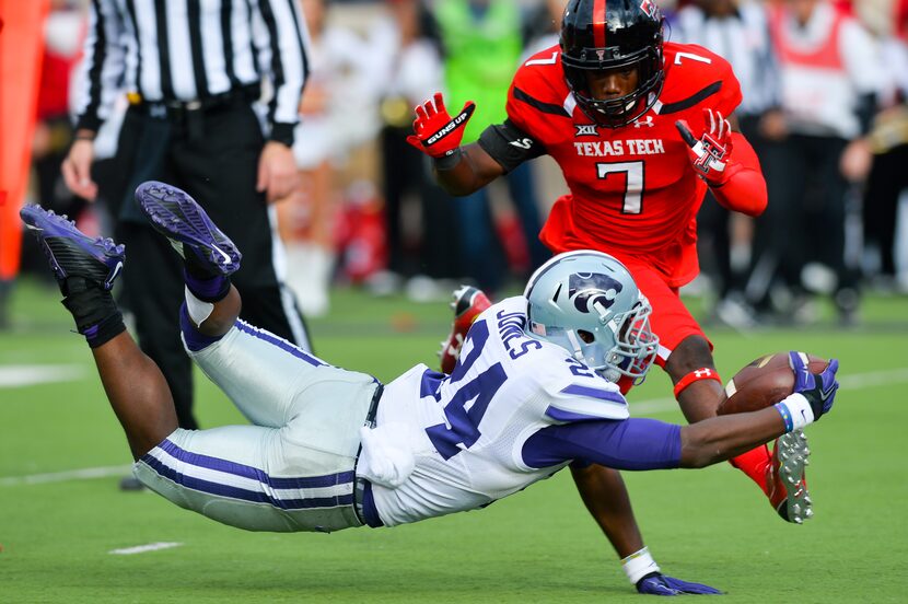 LUBBOCK, TX - NOVEMBER 14: Charles Jones #24 of the Kansas State Wildcats reaches for the...