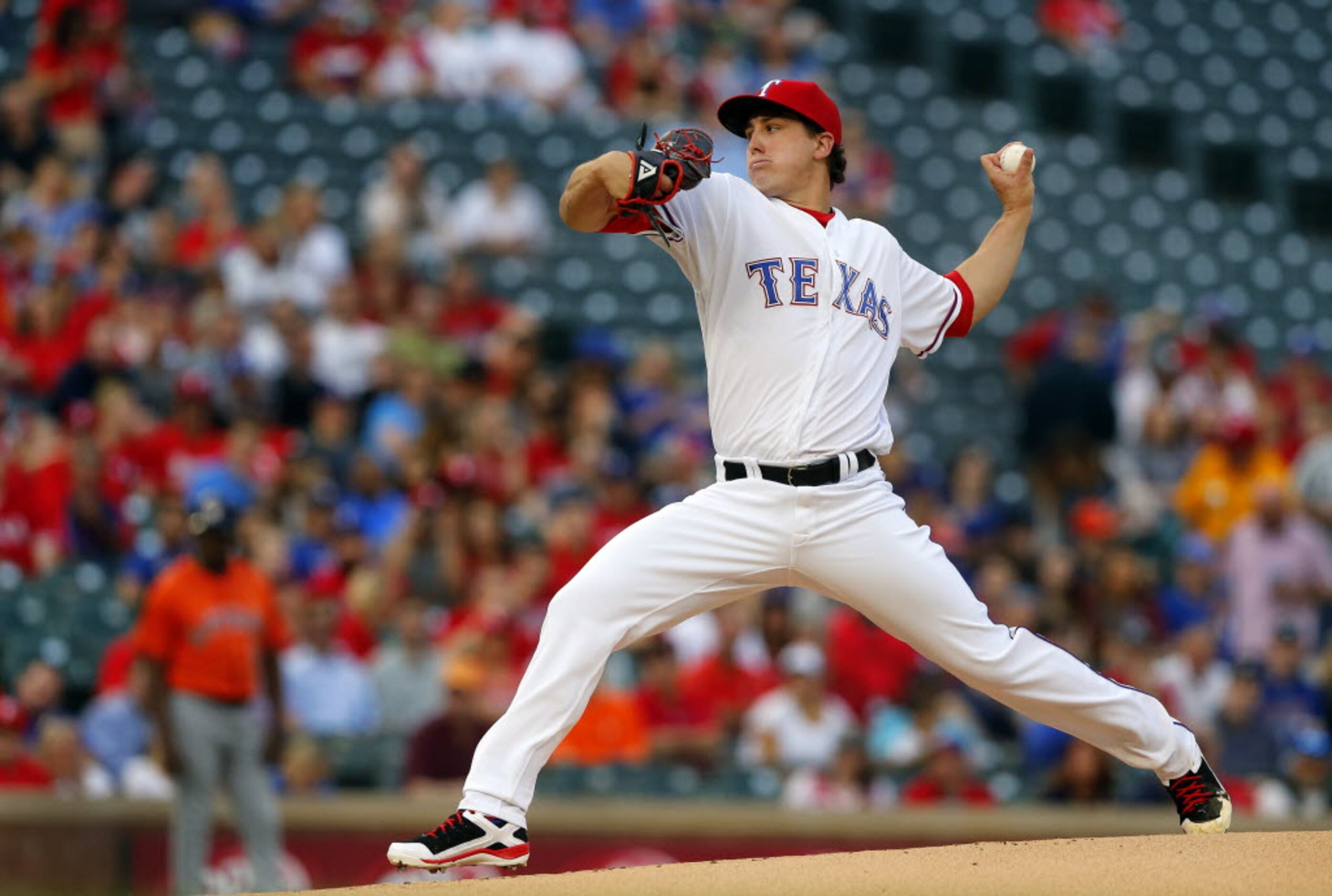 Texas Rangers starting pitcher Derek Holland works against the