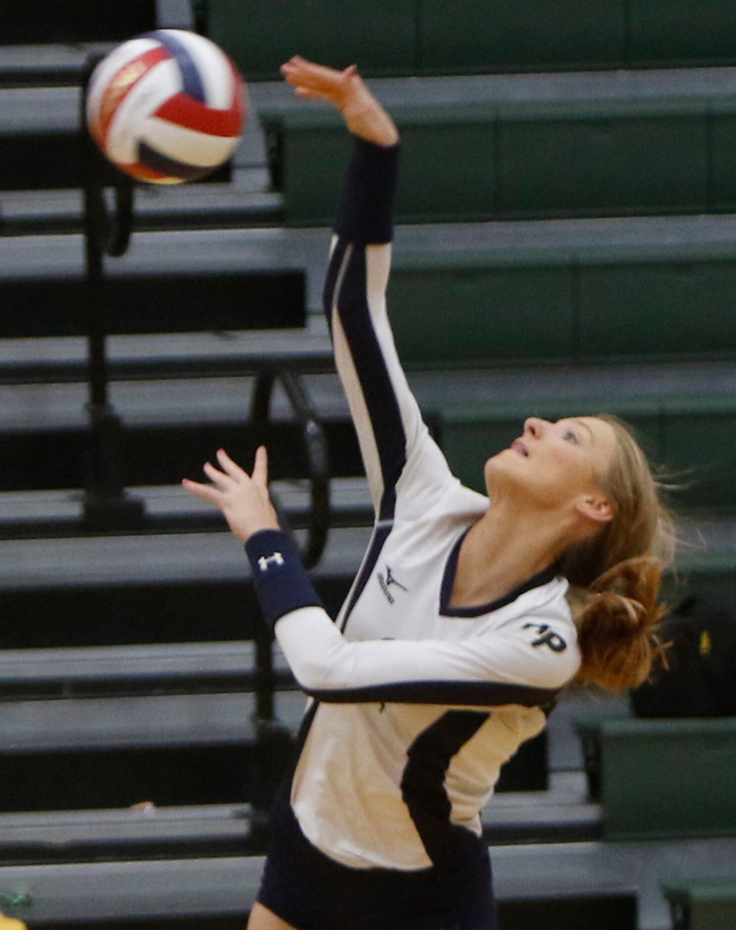 Highland Park outside hitter Kate Nugent (2) powers a spike for a winner during the first...