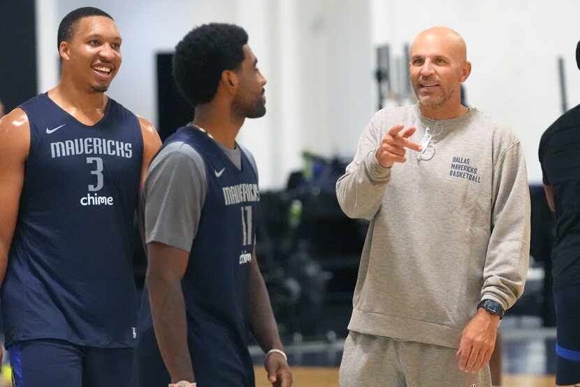 Irving (11), talking with Mavericks head coach Jason Kidd, remembers how Williams (3) helped...