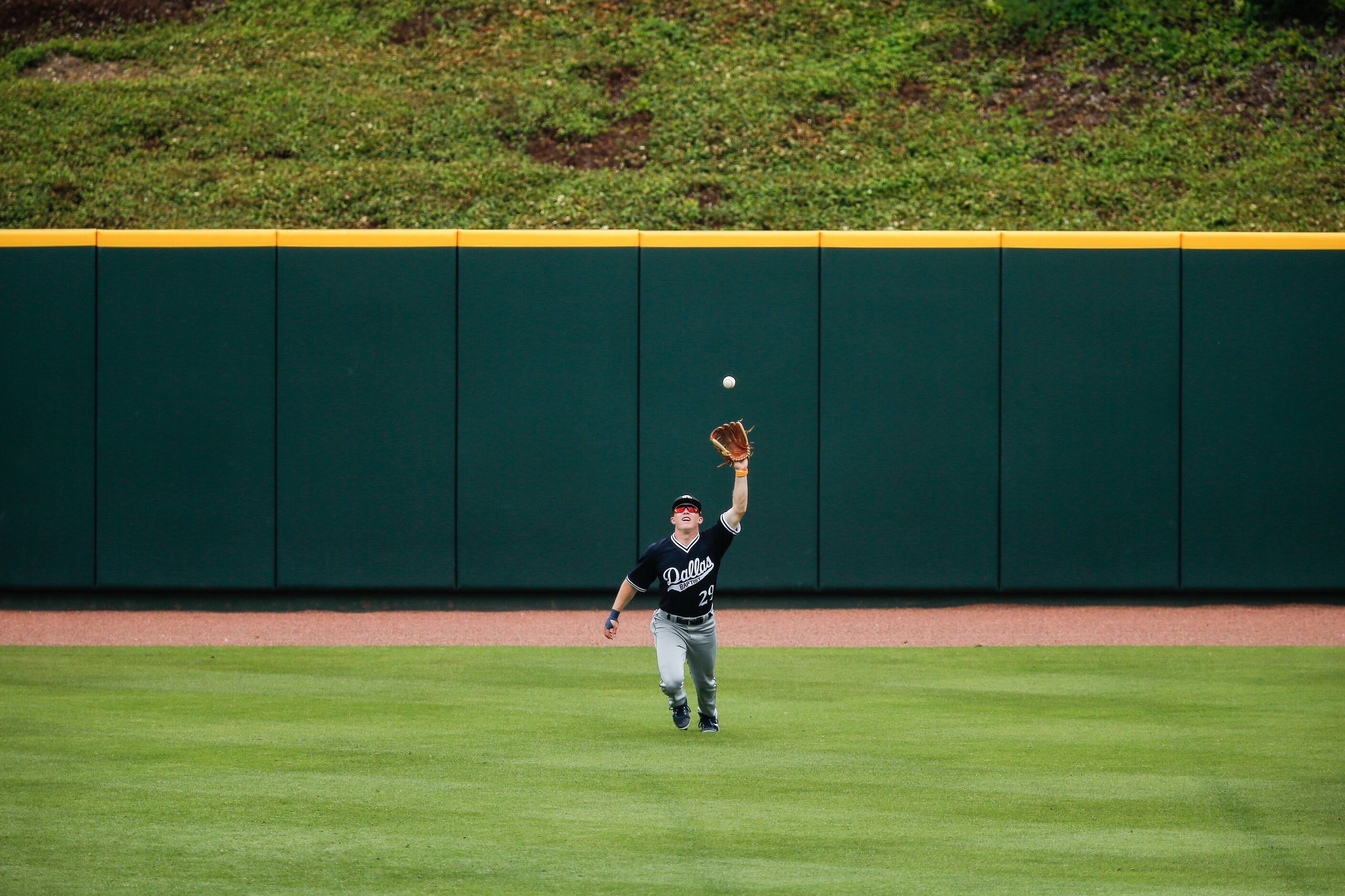 DBU outfielder Jace Grady (29) catches a fly ball hit by Oregon St.’s Garret Forrester in...