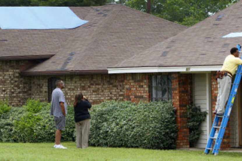 State Farm insurance claims representative Sheldon Goethe assessed roof damage on Vanessa...
