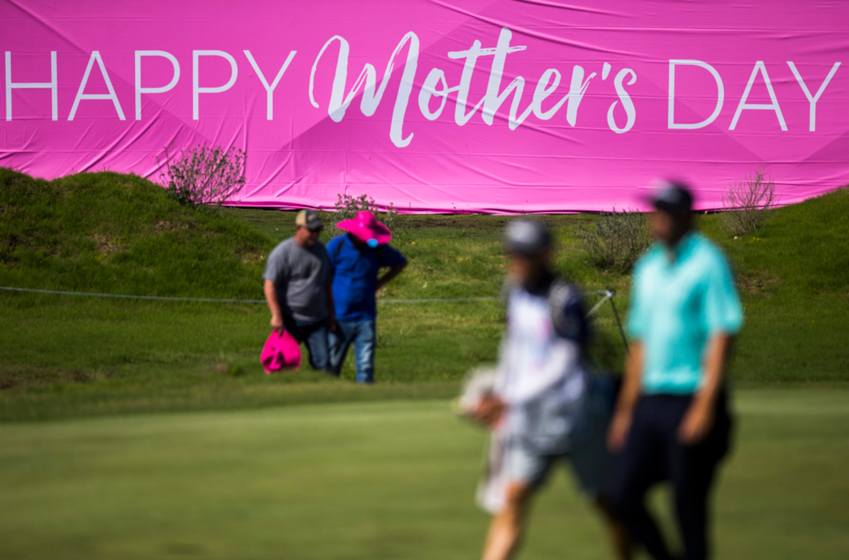 A giant pink sign wishes golfers and spectators a happy Mother's Day during round 4 of the...