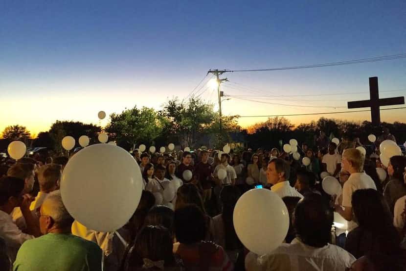  Mourners released white balloons after a memorial Mass for Carlos Perez at St. Jude...