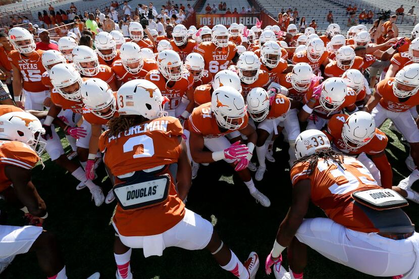 Texas players get fired up during the warm-up at Darrell K Royal Texas Memorial Stadium in...