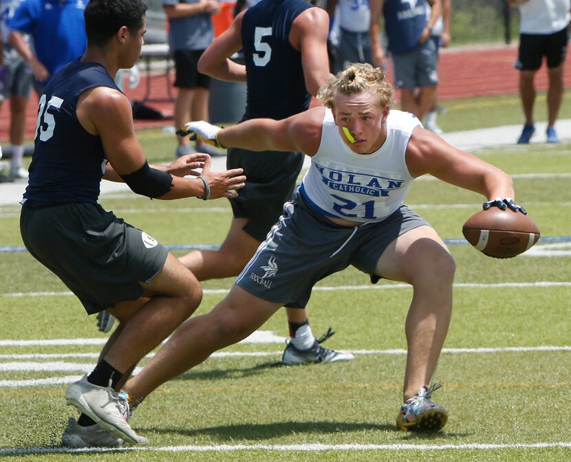 Nolan Catholic's Chance Cover (21) puts a move on Fort Worth All Saints defender BoBo Bettle...