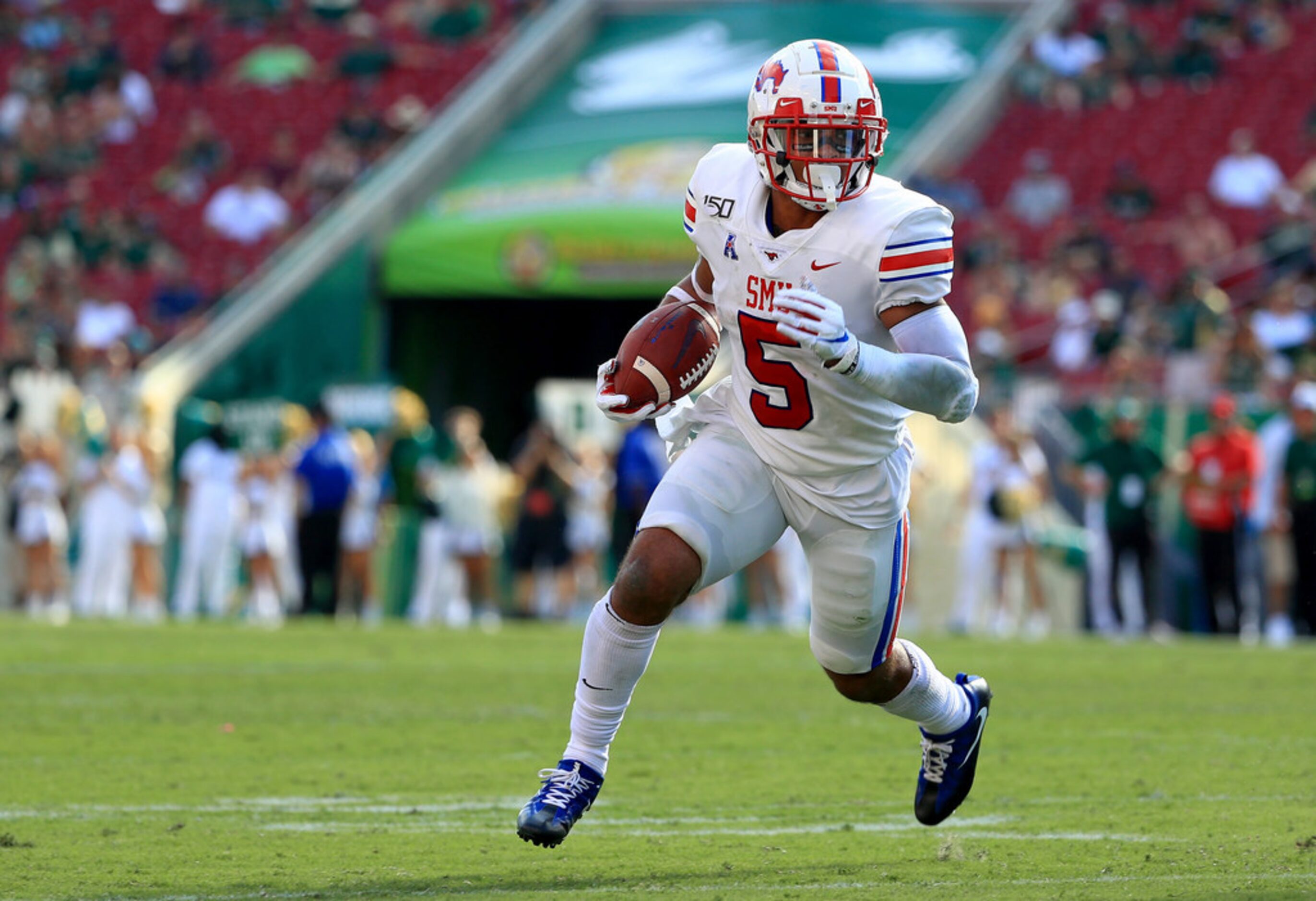 TAMPA, FLORIDA - SEPTEMBER 28: Xavier Jones #5 of the Southern Methodist Mustangs rushes...