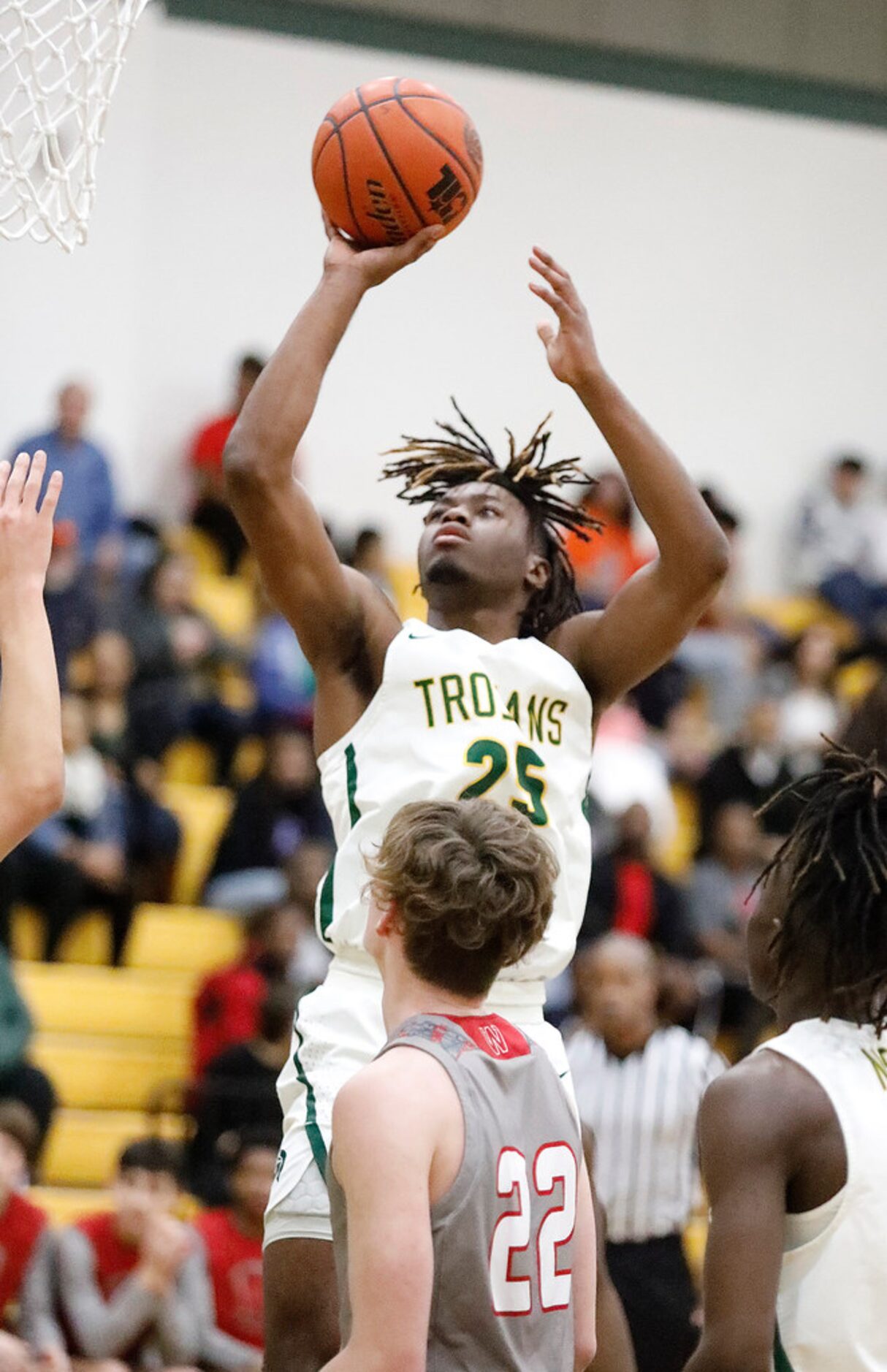 Newman Smith High School forward Domani Villaruel (25) takes a shot during the first half as...