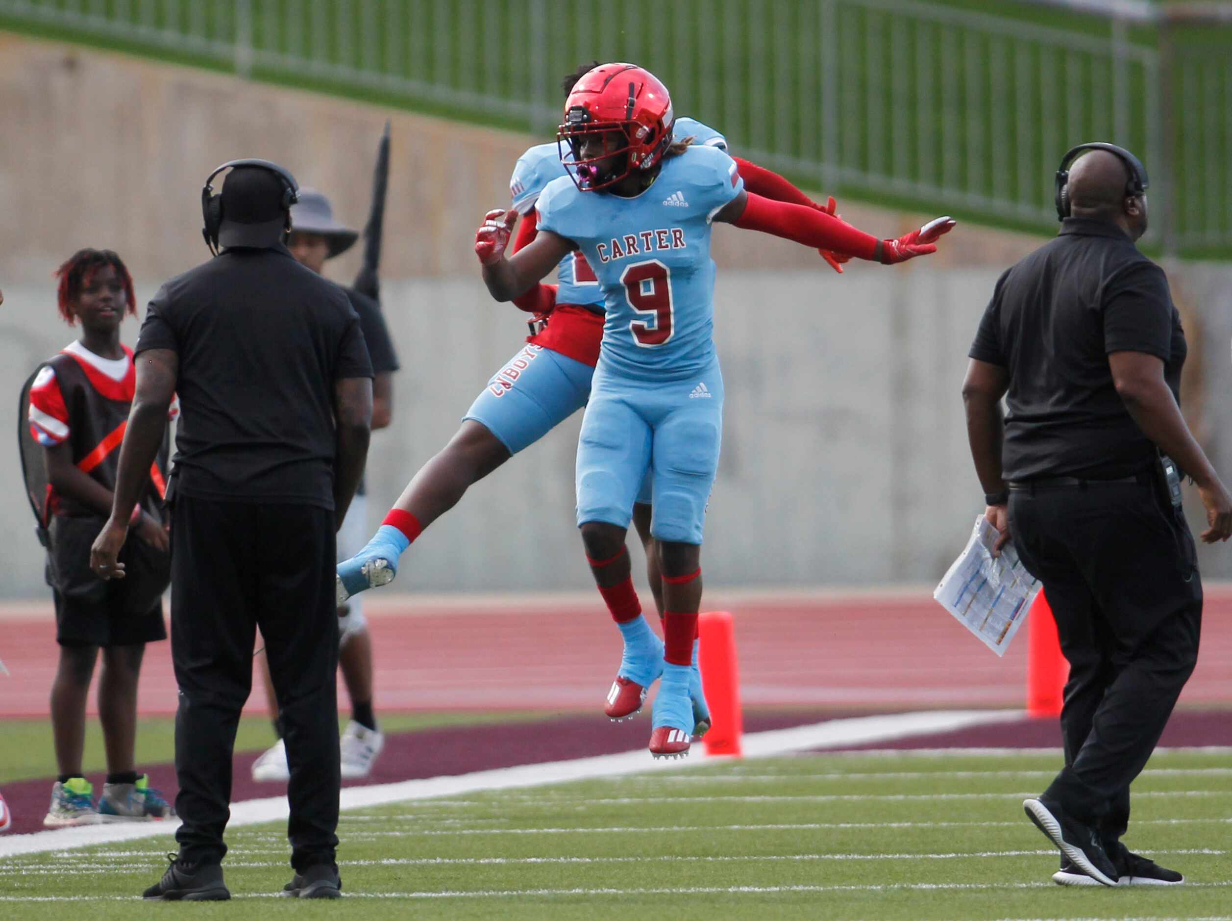 Dallas Carter receiver Khyion Andrews (9) leaps in celebration with a teammate following his...