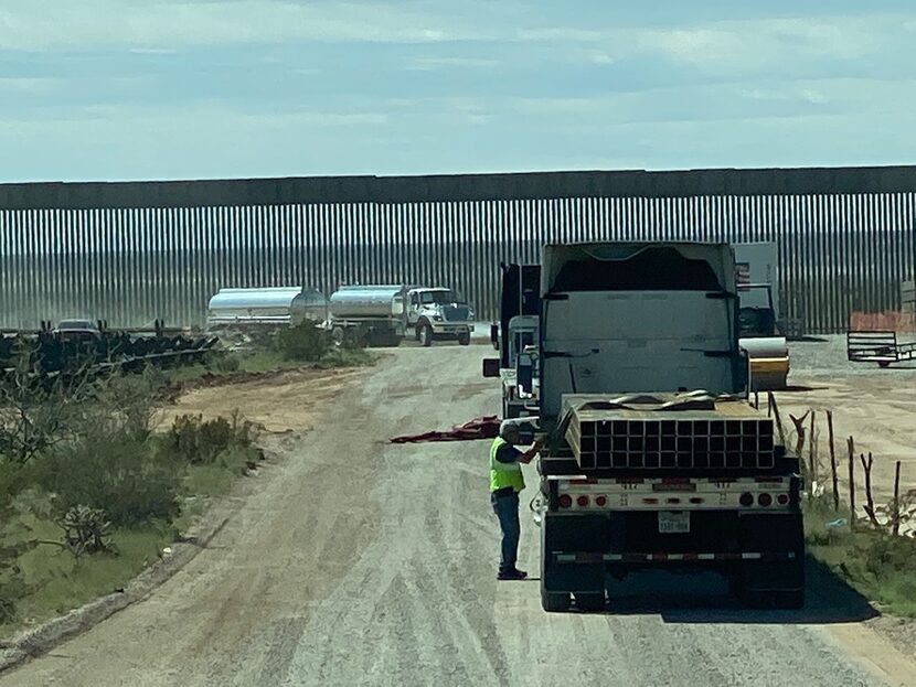 Truckers lined up near the wall construction site April 1 near Columbus, N.M. Truckers and...