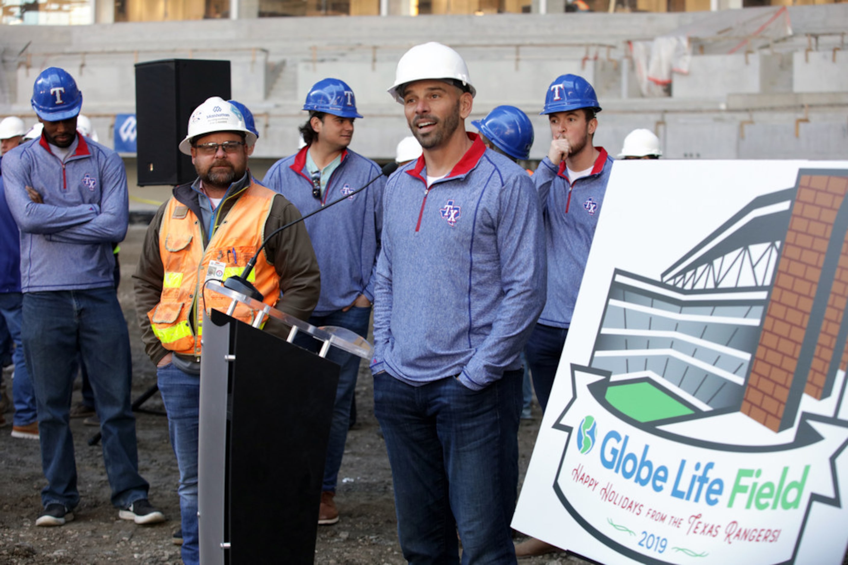 Rangers Manager Chris Woodward speaks to construction workers during a holiday lunch at...