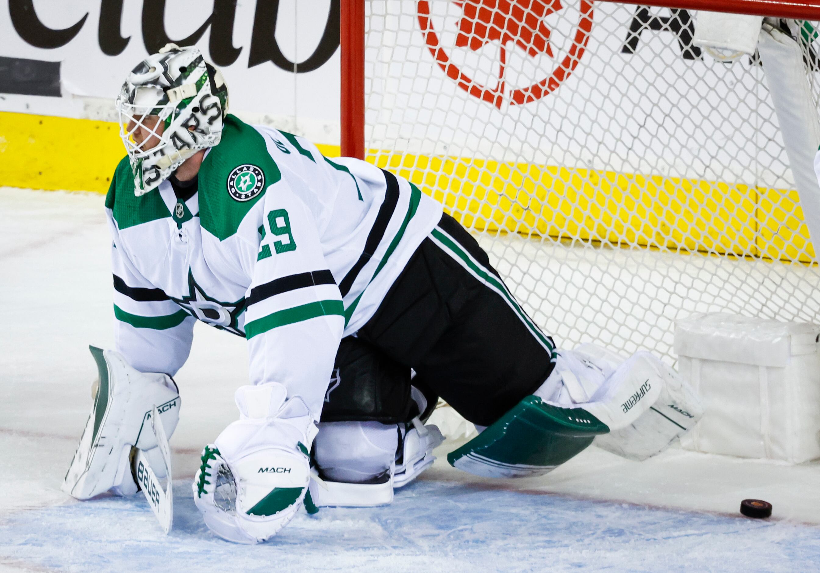 Dallas Stars goalie Jake Oettinger reacts to letting in the game-winning goal in overtime...