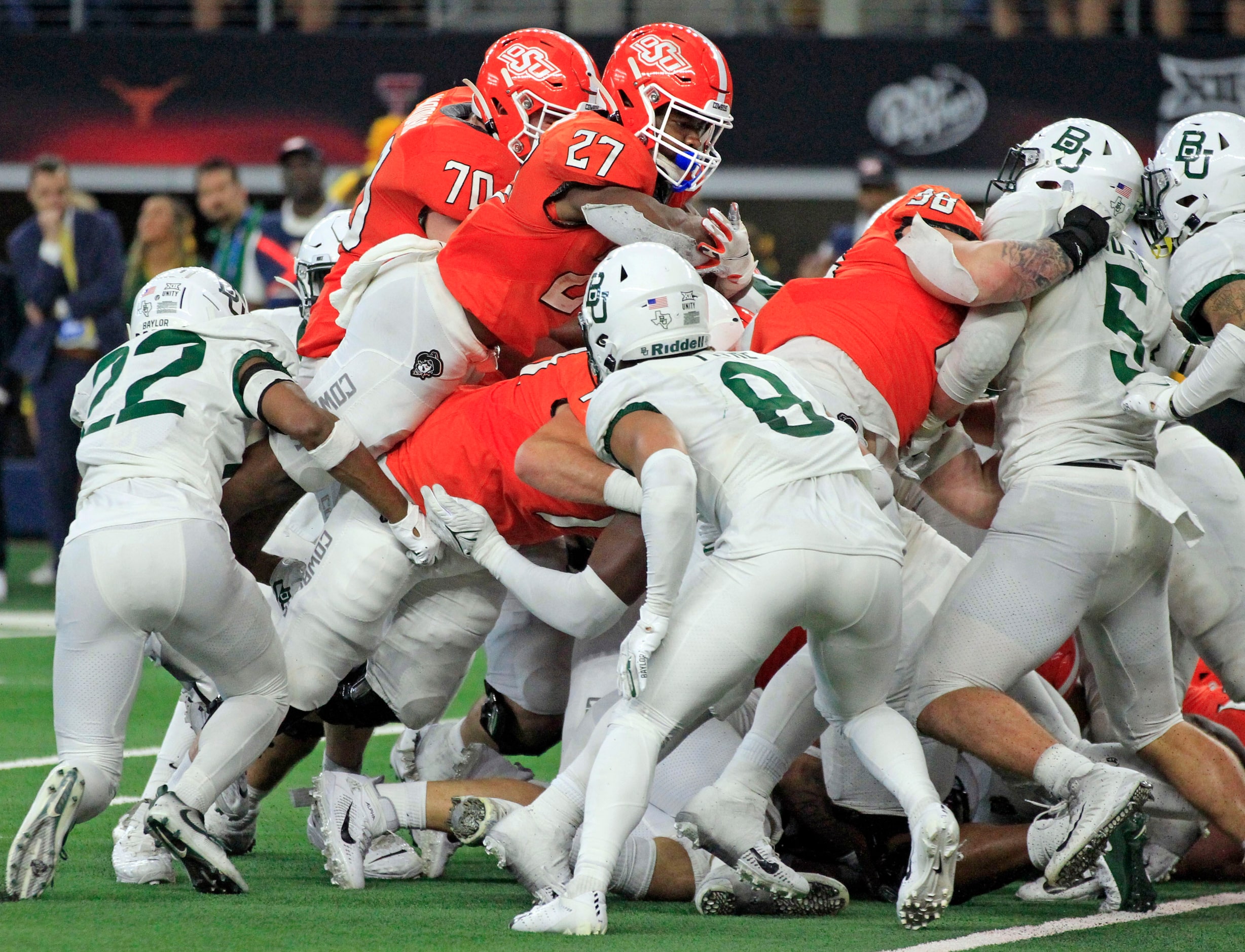 Oklahoma State Cowboys running back Dezmon Jackson (27) is stopped short of the end zone by...