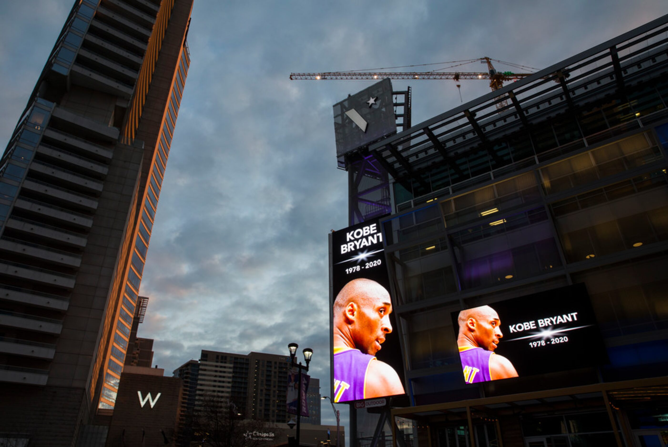 Large screens display a tribute to former Los Angeles Laker Kobe Bryant and his daughter,...