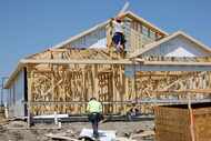 Construction workers frame new houses in Eastland new home community, Tuesday, May 14, 2024,...