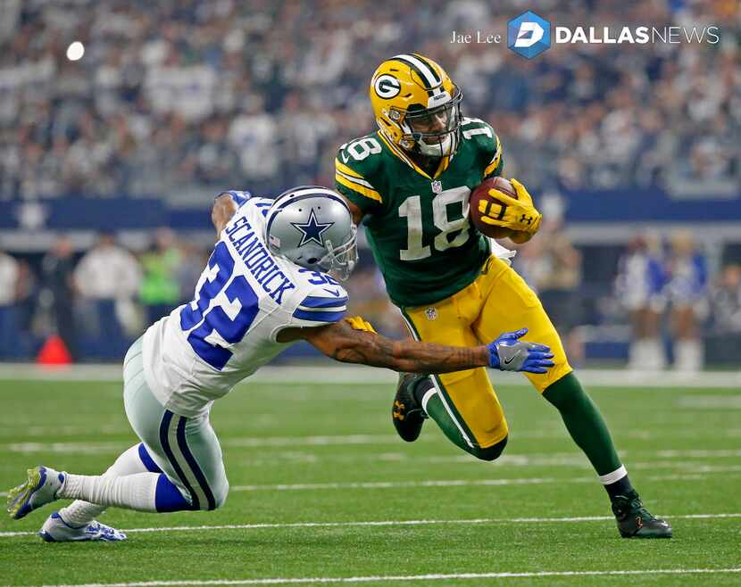 Green Bay Packers wide receiver Randall Cobb (18) is tackled by Dallas Cowboys cornerback...