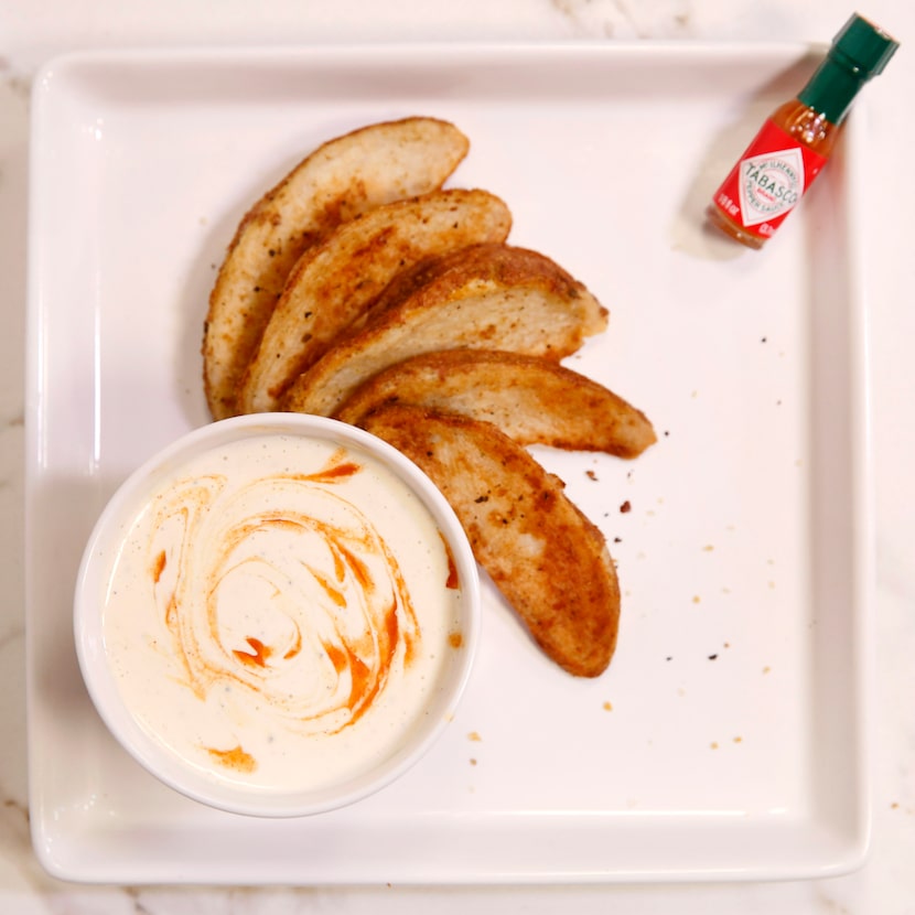 White Hot Barbecue is served with baked potato wedges.