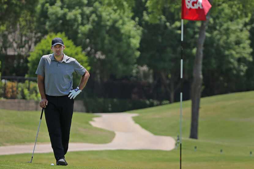 Former Dallas Cowboys quarterback Tony Romo contemplates his options on  the 18th green as...