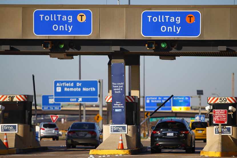 TollTag users use the cashless booths at the north end of Dallas/Fort Worth International...