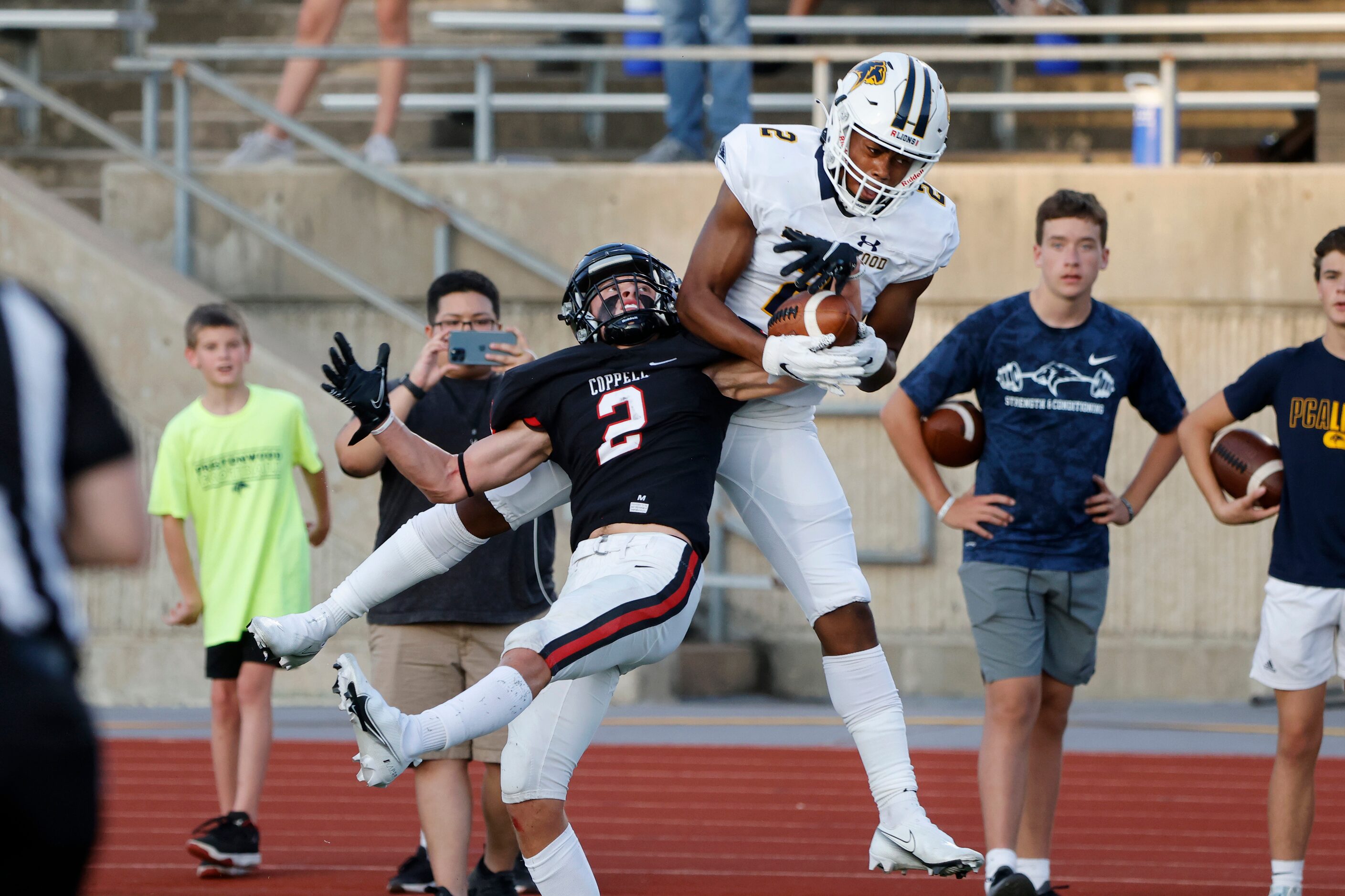 Coppell’s Miles Hardy (2), left, intercepts the ball from Prestonwood Christian Academy...