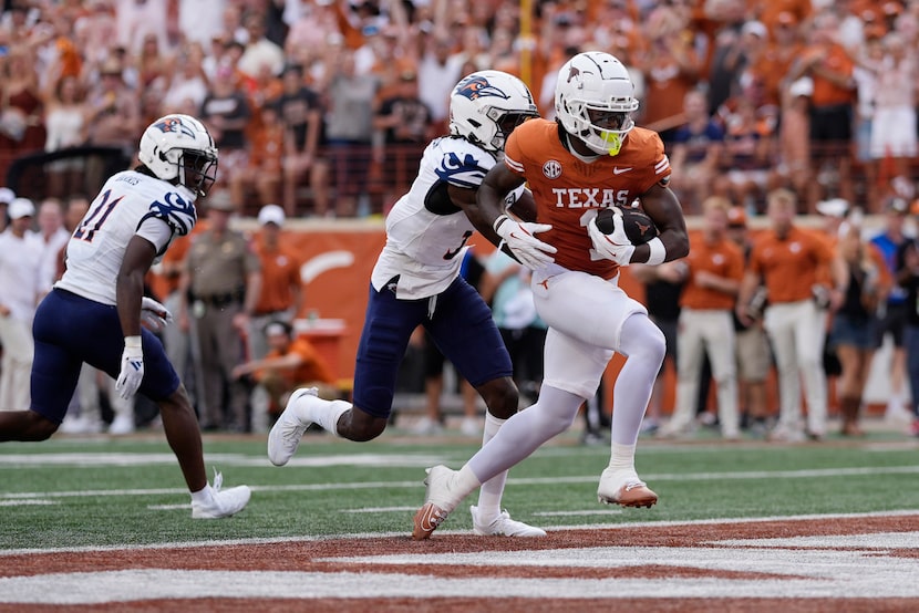 Texas wide receiver Johntay Cook II (1) scores a touchdown against UTSA during the first...