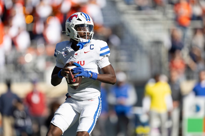 SMU quarterback Kevin Jennings (7) looks to pass during the first half of an NCAA college...