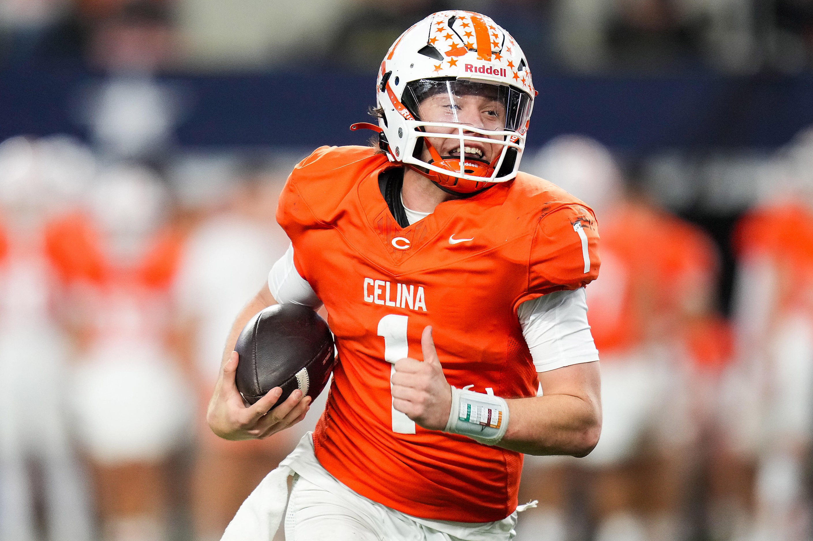 Celina's Bowe Bentley runs for a first down during the second half of the Class 4A Division...