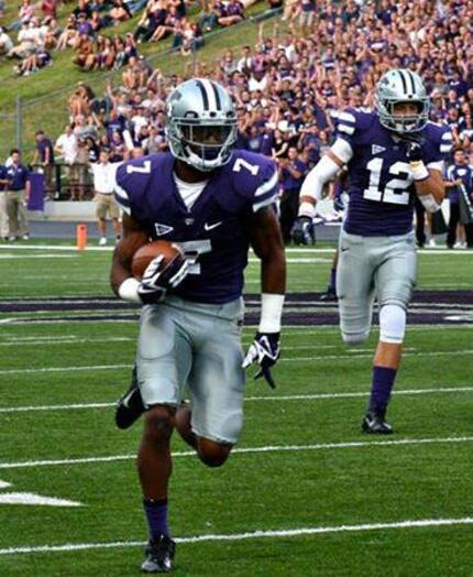 Carrollton police Officer Kip Daily runs with the ball in a Kansas State game.