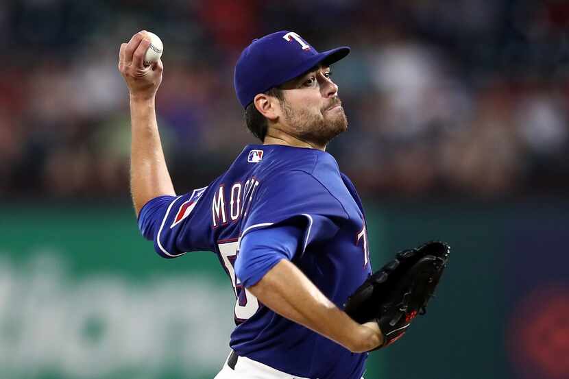 ARLINGTON, TX - MAY 07:  Matt Moore #55 of the Texas Rangers throws against the Detroit...