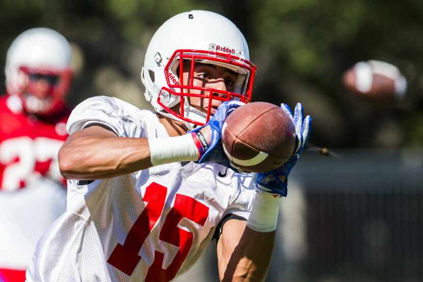 SMU wide receiver Alex Honey (15) catches a pass while the SMU football team practices on...