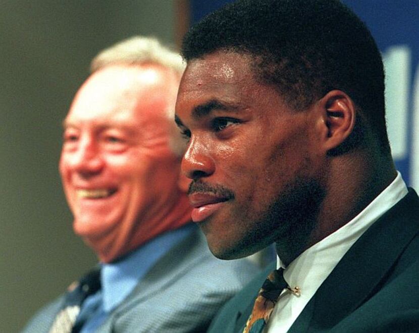 Herschel Walker, who won the Heisman Trophy during his college career at Georgia, and went...