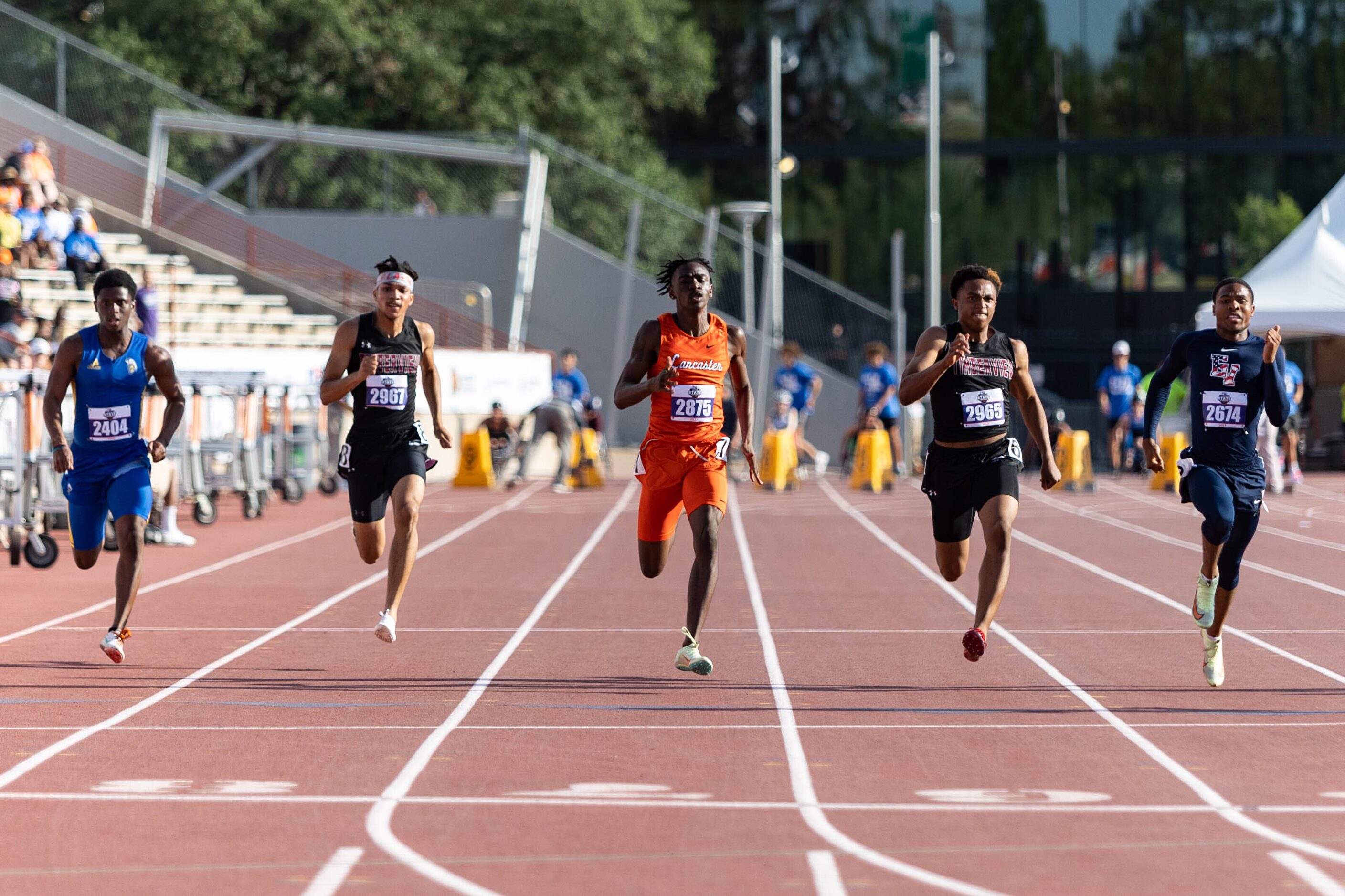 Lancaster’s Kordarion Smith, center, and Mansfield Timberview’s Jordan Sanford, second from...